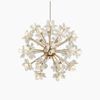 Gold-frame chandelier with integrated LEDs, starburst arms, and crystal spheres for a modern look.