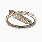 Overlapping stainless steel rings with diamond-shaped crystals emit bright white LED light chandelier.