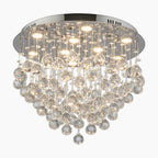 Ornate round chandelier with 9 LED lights, chrome base, and cascading K9 crystal droplets.