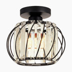 Ornate black metal mini pendant chandelier with clear crystal-style glass and exposed LED bulb.