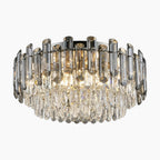 Modern crystal chandelier with clear and smoky glass prisms, circular shape, warm dimmable LED glow.