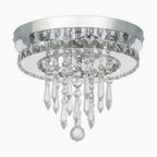 Modern LED chandelier with chrome base and circular crystal tiers for a sparkling, elegant look.