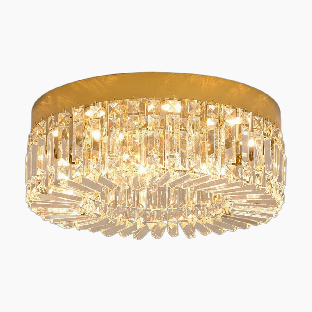 Modern gold chandelier with integrated LED and clear crystal prisms, emitting a warm elegant glow.