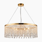 Sleek nickel chandelier with elegant pendants, three-wire suspension, and dimmable LED-lit hanging crystals.