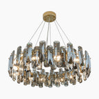Modern crystal LED chandelier with circular faceted crystals, sleek wires, and warm ambient lighting.