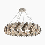 Elegant stainless steel crystal LED chandelier with faceted crystals and four suspension cables.