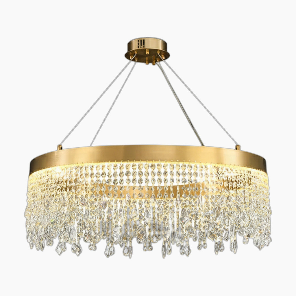 Modern crystal chandelier with gold ring, round pendants, and sparkling prisms suspended by four cables.