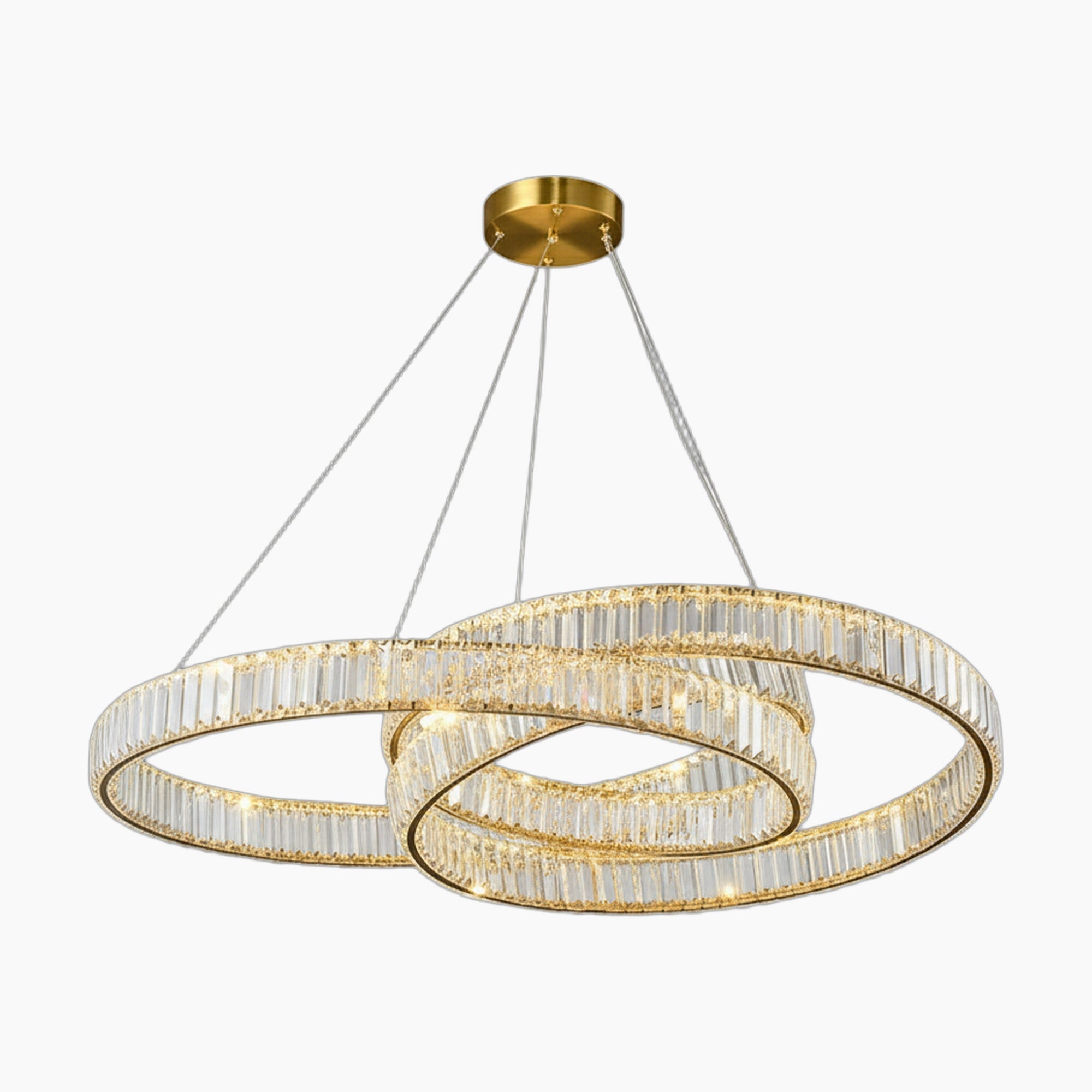 LED chandelier with intertwined crystal rings, brass mount, and thin suspension cables; sleek modern design.