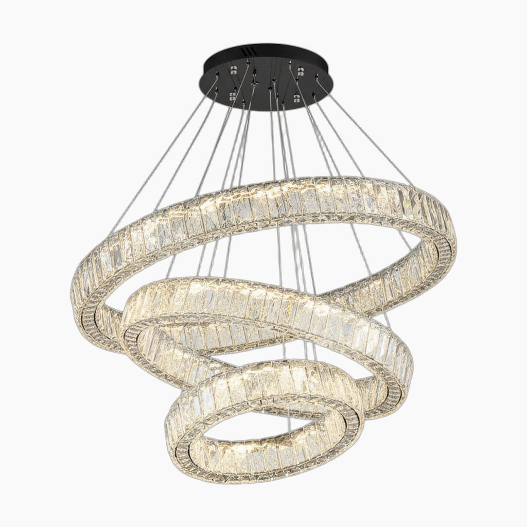 Three crystal-adorned rings form a modern chandelier, suspended from a sleek black ceiling mount.