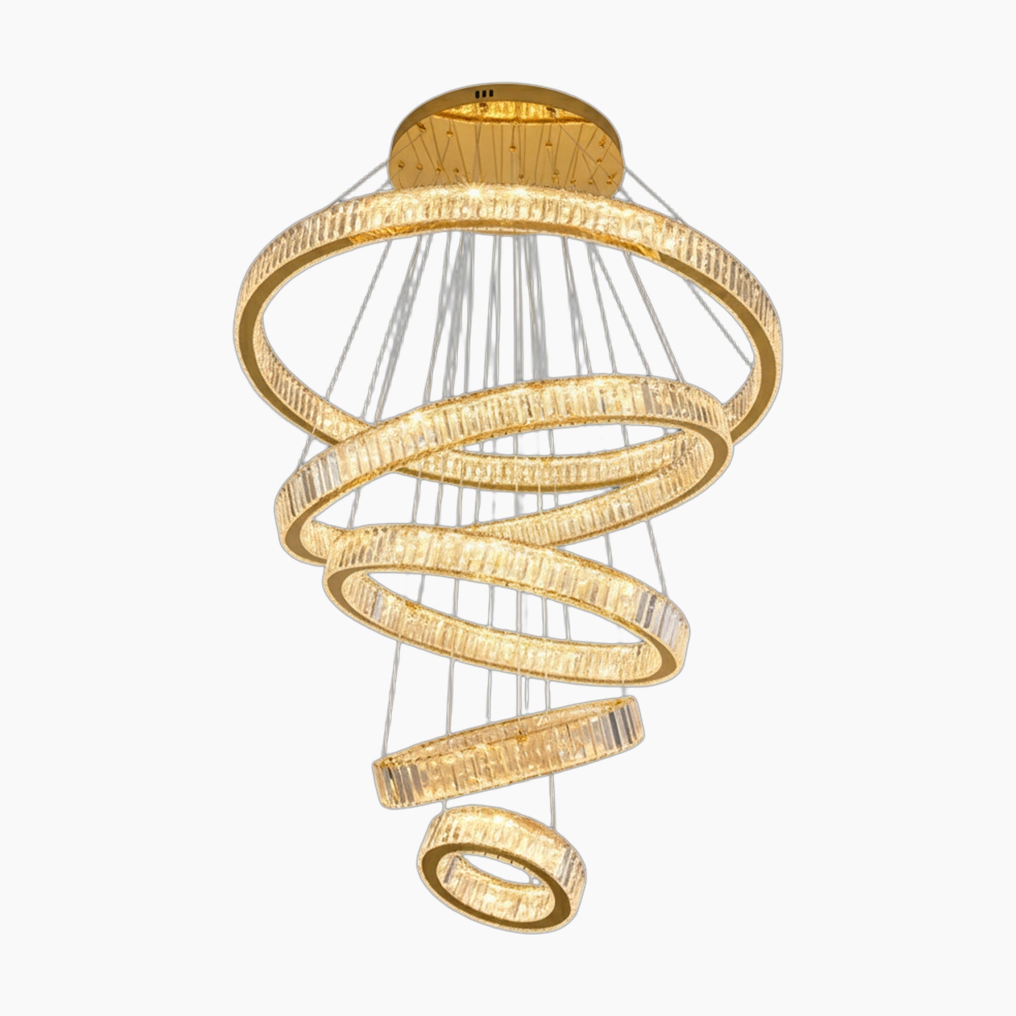 Five spiral gold-accented crystal chandelier rings are suspended by thin wires in a modern design.