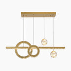 Modern crystal chandelier with interlocking rings and three glass spheres for elegant, chic lighting.