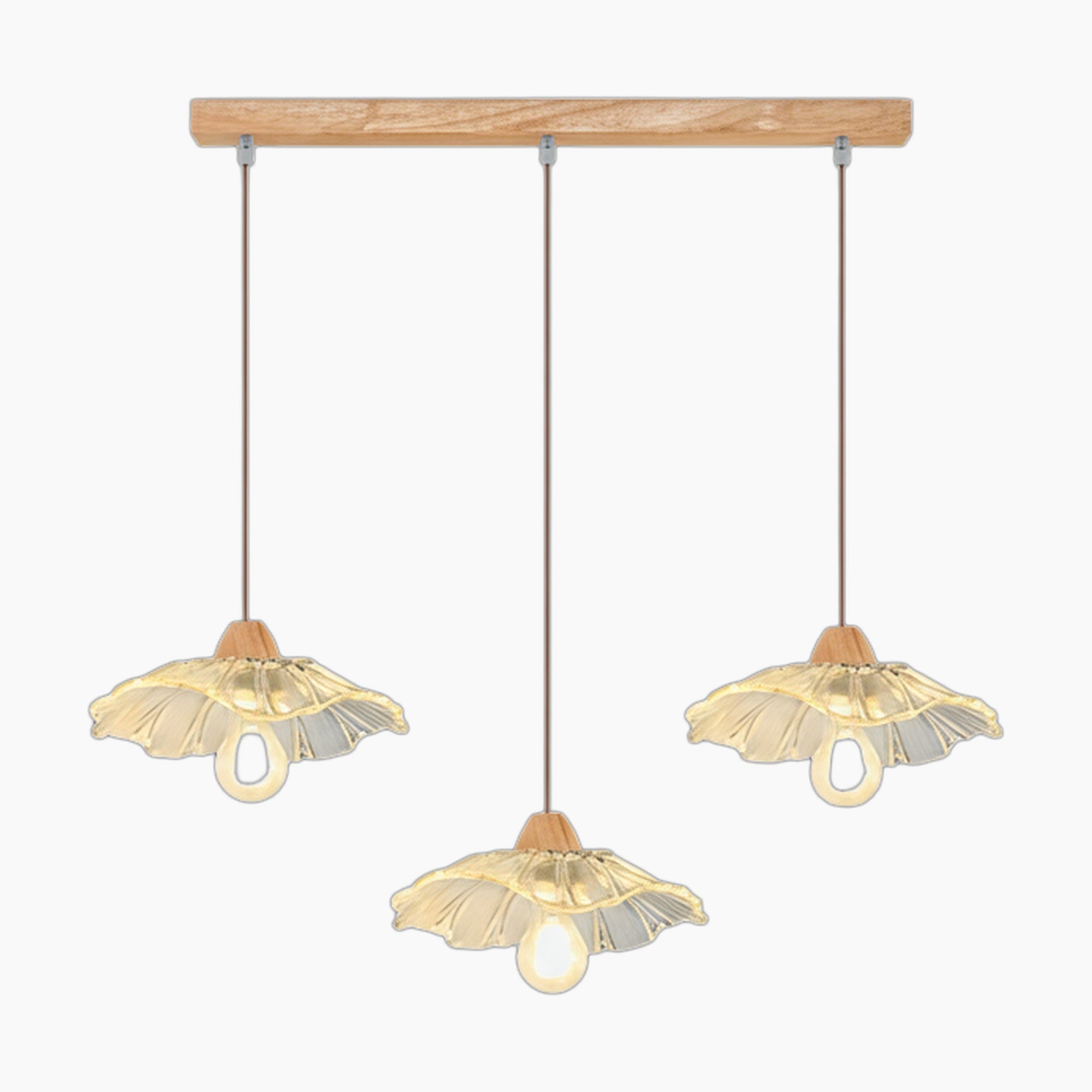 Three glass, flower-shaped chandelier shades hang on brown cords from a wooden bar with visible bulbs.