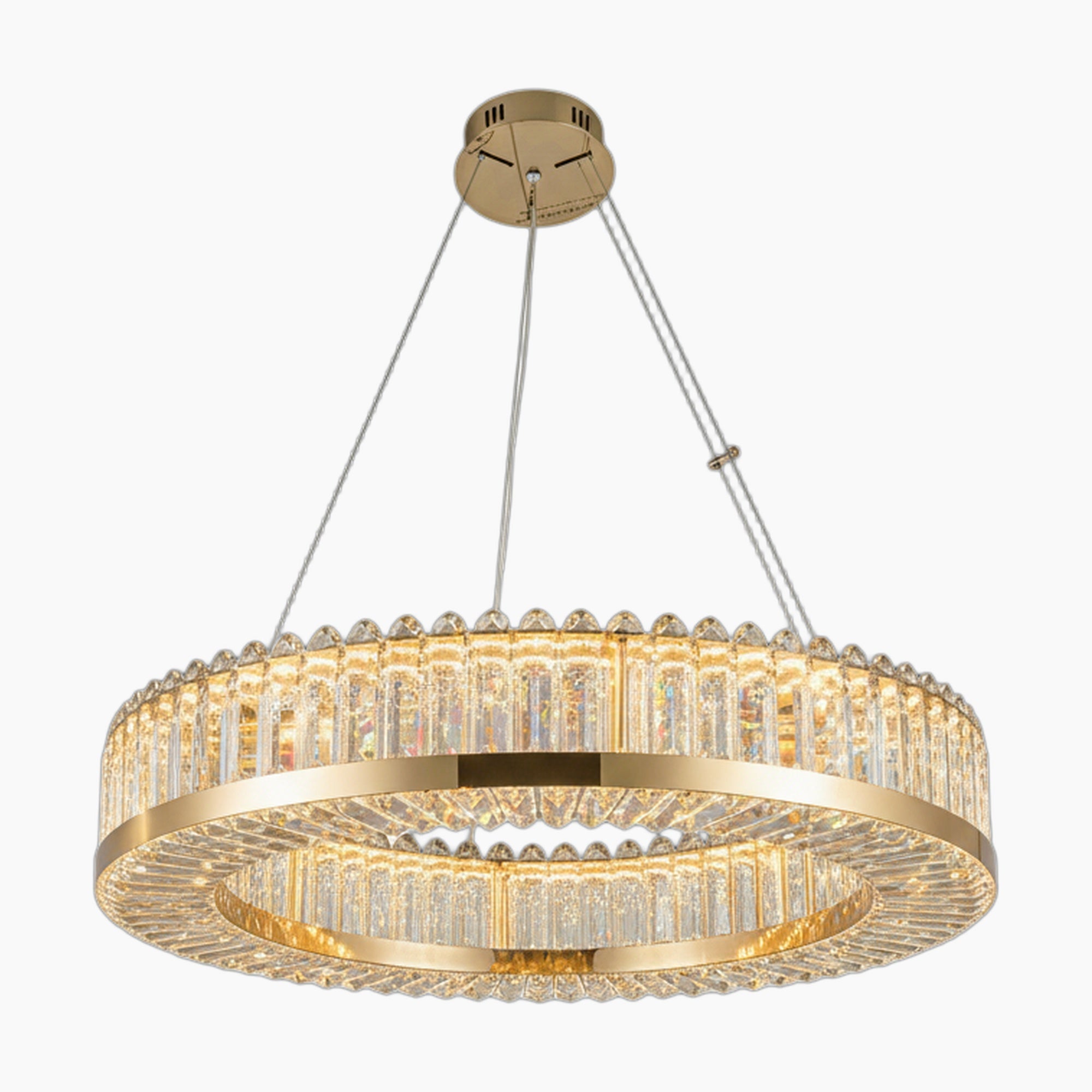 Geometric circular chandelier with clear crystal prisms, suspended by cables, emits elegant warm light.