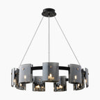 Modern Scandinavian chandelier with black frame, smoky glass panels, and three suspension cables. LED fixture.