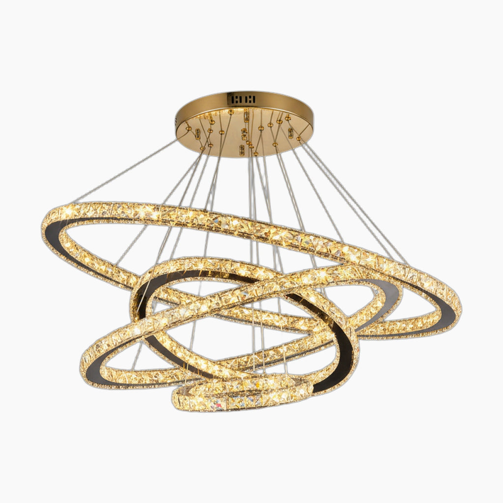 Intertwined gold ring chandelier with sparkling crystals, silver cables, and gold ceiling mount. Modern style.