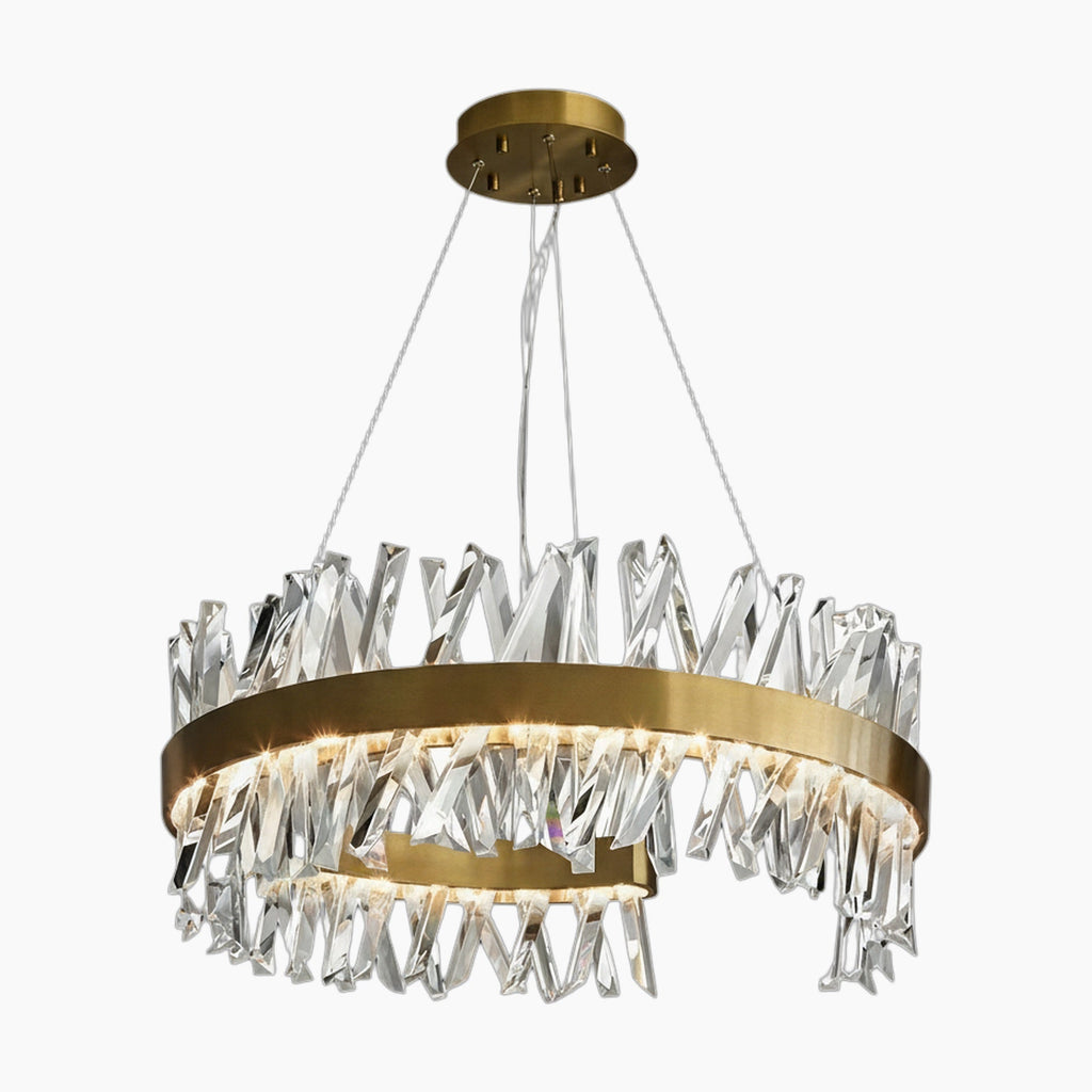 Circular gold chandelier with jagged clear crystals and integrated lights, suspended by three wires.
