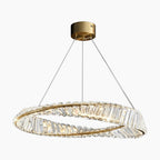 Gold crystal chandelier with oval twisted ring suspended by three wires from a round gold mount.