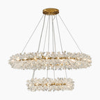 Modern round chandelier with two oval tiers, crystal accents, gold mount, multiple bulbs, suspended wires.
