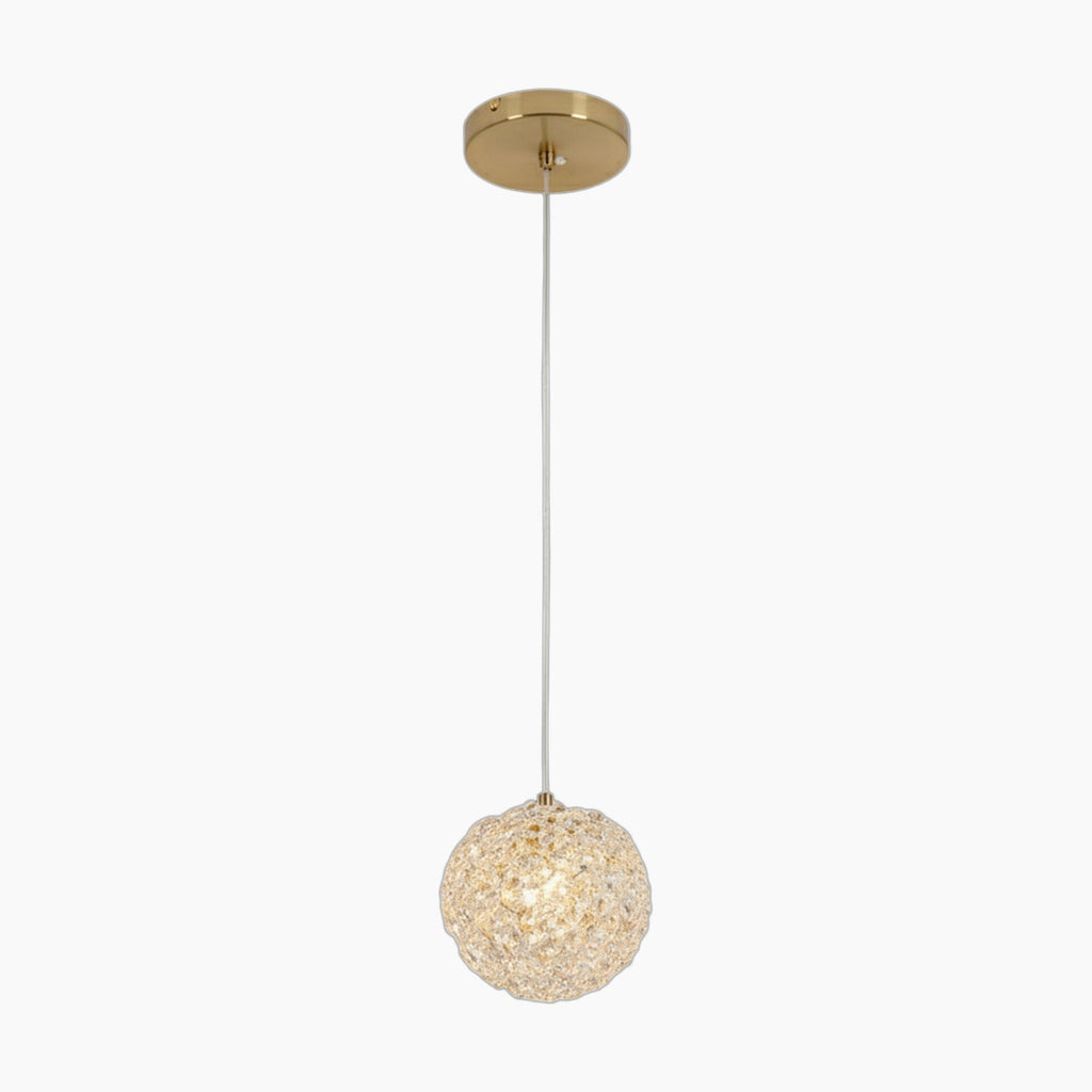 Modern crystal ball chandelier with textured round glass shade, white cord, gold ceiling mount.