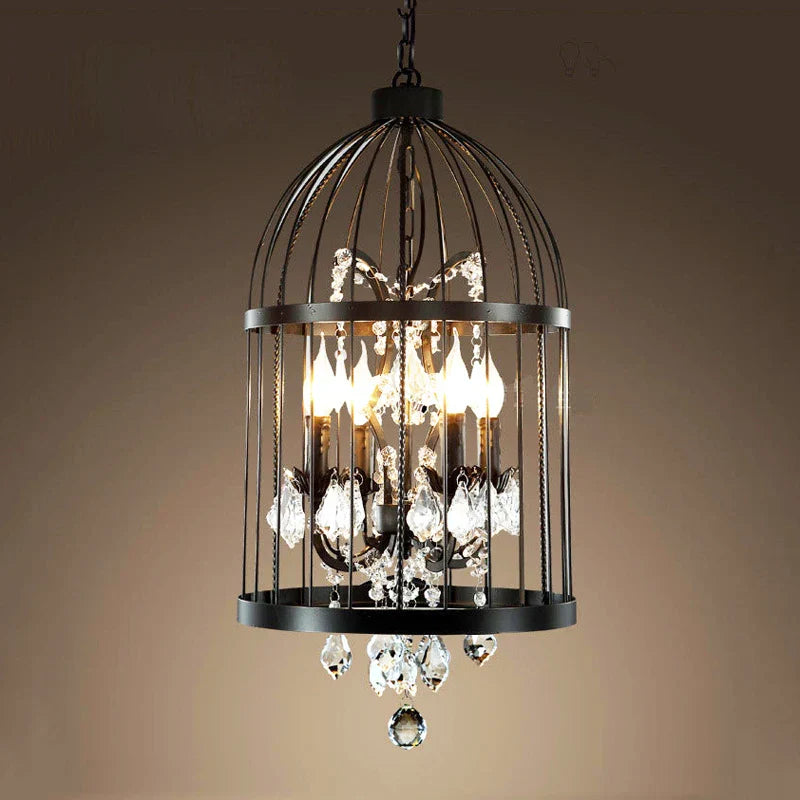 Ornate vintage crystal chandelier in black bird cage frame with warm E14 bulbs, ceiling-mounted.