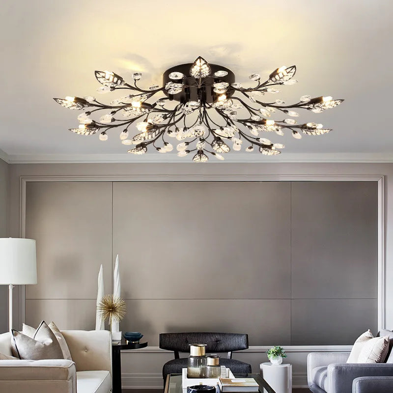 Maison Ornate gold or black crystal LED chandelier, glowing branch design, luxurious modern lighting.