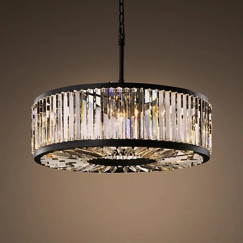 Black-framed vintage modern chandelier with vertical crystal prisms, casting warm, shimmering light.