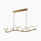Golden crystal chandelier with six glass bird LED lamps on a curved metal branch.