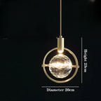 Postmodern gold chandelier with faceted glass globe centerpiece, 23cm high by 20cm wide.