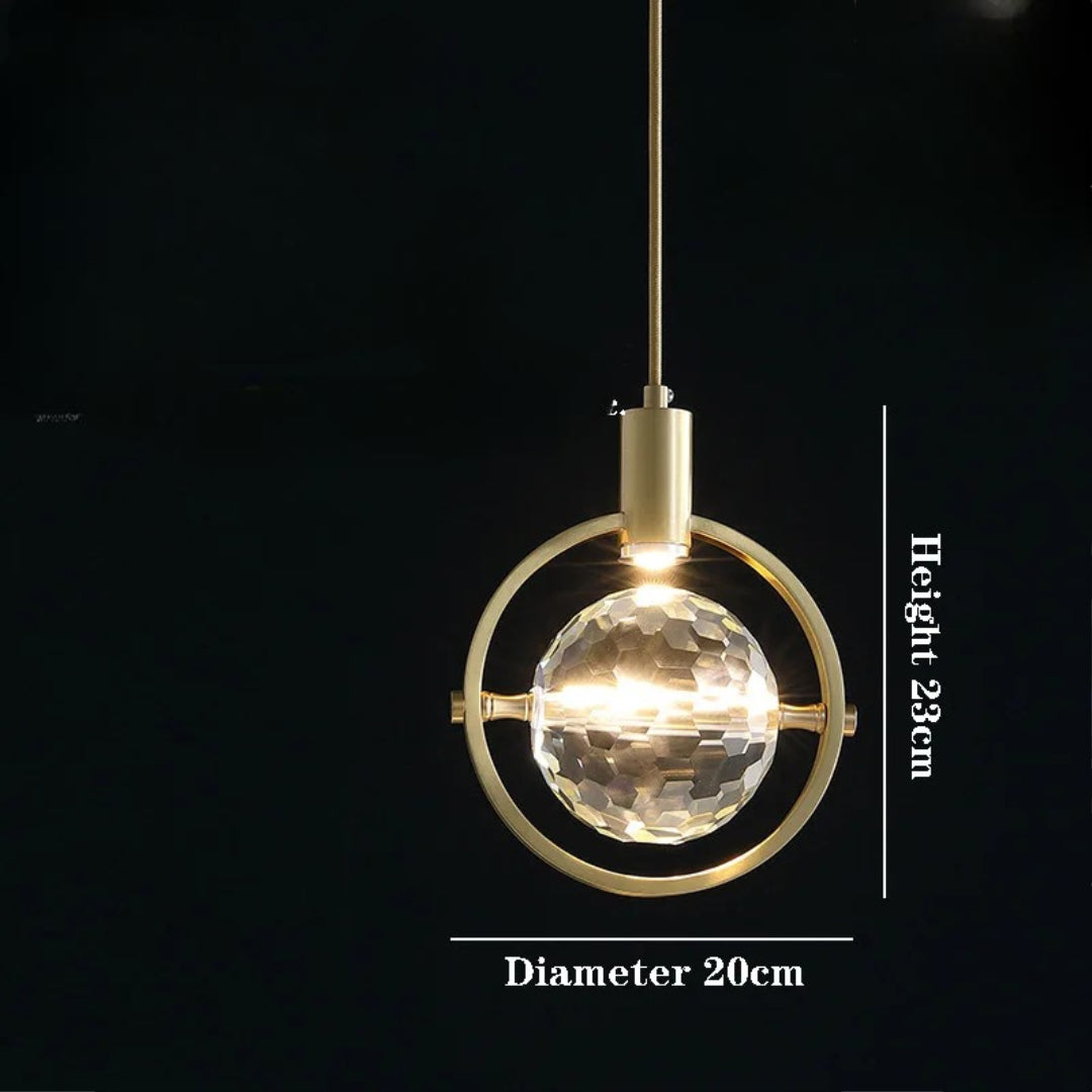 Postmodern gold chandelier with faceted glass globe centerpiece, 23cm high by 20cm wide.