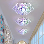 Three Maison Ornate Crystal Ball Chandeliers with floral designs and vibrant, colorful illumination.