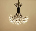 Black metal-armed chandelier with LED-lit crystal clusters, creating a modern blooming floral effect.