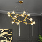 Maison Ornate Nordic minimalist crystal chandelier with intersecting gold rings and glowing glass bulbs.