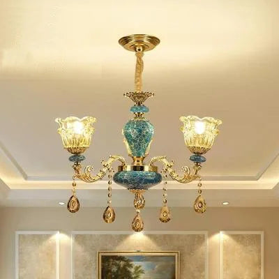 Baroque chandelier with three glass lamps, turquoise blue and gold accents, and crystal teardrops.