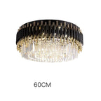 Black and gold chandelier with hanging crystals, modern LED-lit design, 60 cm diameter.