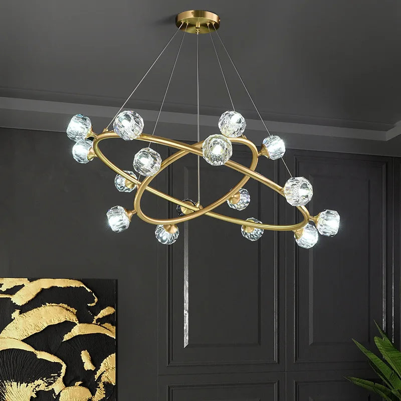 Maison Ornate Nordic Minimalist chandelier with two crystal-ring pendants, suspended by four wires.