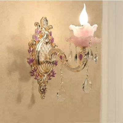 Art Deco chandelier with gold and purple floral accents, pink flower shade, and crystal pendants.
