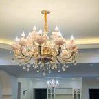 Two Maison Ornate Art Deco crystal chandeliers with pink flower-shaped glass and crystal accents.