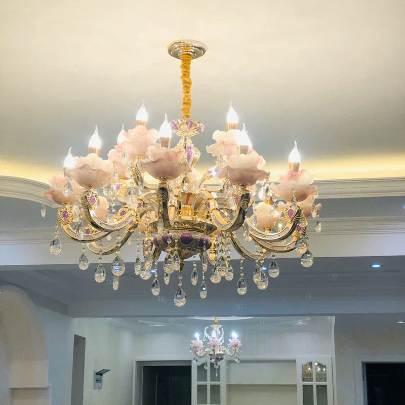 Two Maison Ornate Art Deco crystal chandeliers with pink flower-shaped glass and crystal accents.