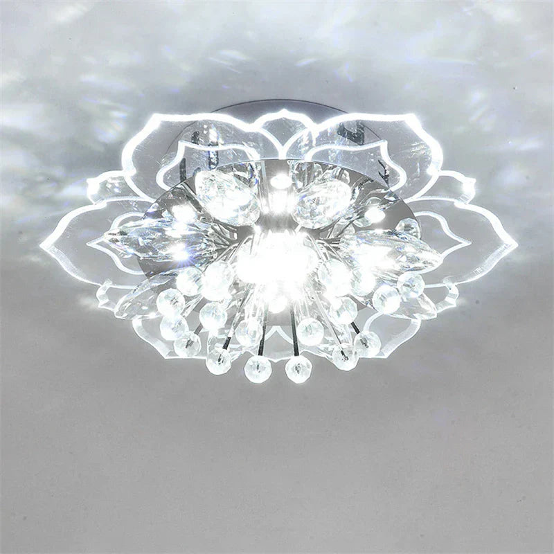 Art Deco-style crystal ball chandelier with colorful flowers and sparkling elements, elegant indoor lighting.