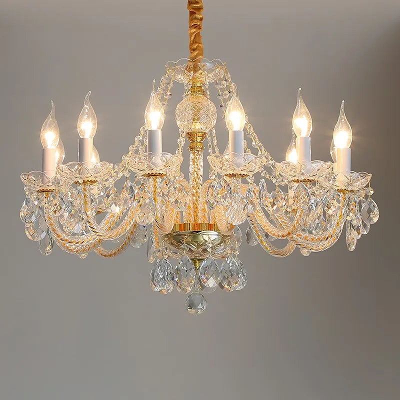 Maison Ornate Baroque Crystal Chandelier with gold accents, eight candle bulbs, and hanging crystals.