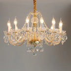 Maison Ornate Baroque Crystal Chandelier with gold accents, eight candle bulbs, and hanging crystals.