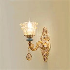 Baroque crystal and ceramic chandelier with floral glass shade, blue accents, and teardrop crystal pendant.