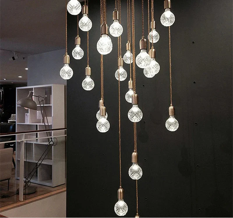 Maison Ornate Postmodern Crystal LED Chandelier with glass bulbs hanging artfully at varied heights.