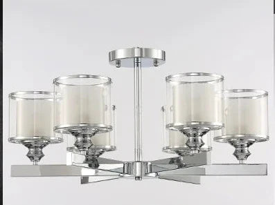Modern chrome chandelier with five cylindrical glass crystal shades, each holding a white candle-style light.