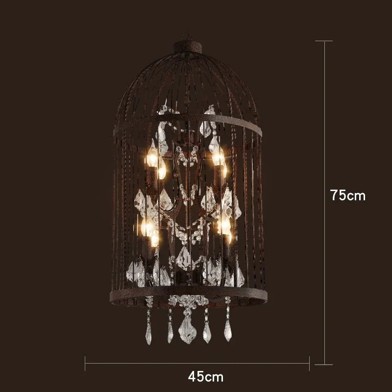 Art Deco chandelier with a black iron birdcage frame, dangling crystals, and glowing bulbs.