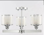Three white-lined cylindrical glass shades on a metallic frame with central vertical rod suspension.
