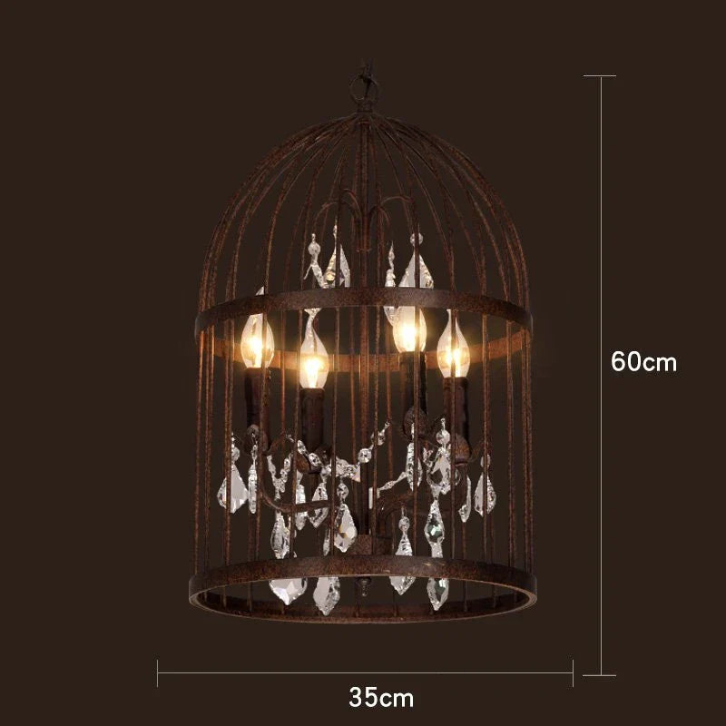 Maison Ornate Art Deco chandelier with black iron cage, three exposed bulbs, hanging crystals.
