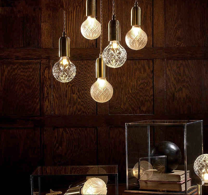 Five ornate postmodern crystal LED glass pendant lights, elegant and ideal for modern interiors.
