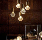 Five ornate postmodern crystal LED glass pendant lights, elegant and ideal for modern interiors.