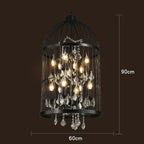 Maison Ornate Art Deco chandelier with black iron cage, exposed bulbs, and hanging crystals, 90x60 cm.
